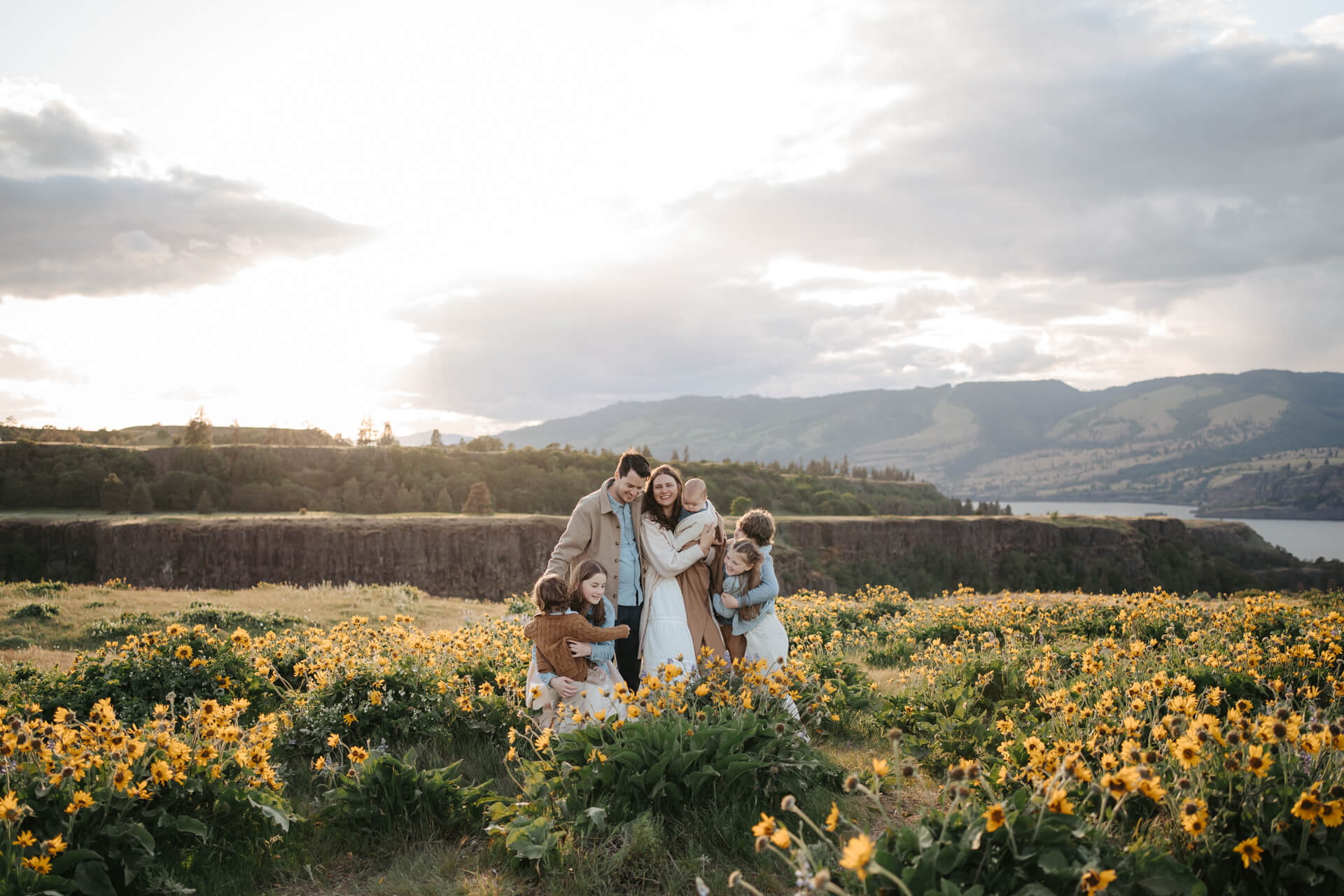 Family of 7 standing in a beautiful wildflower field in Columbia River Gorge